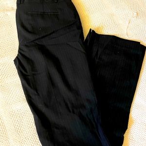 Pinstriped black business pants.